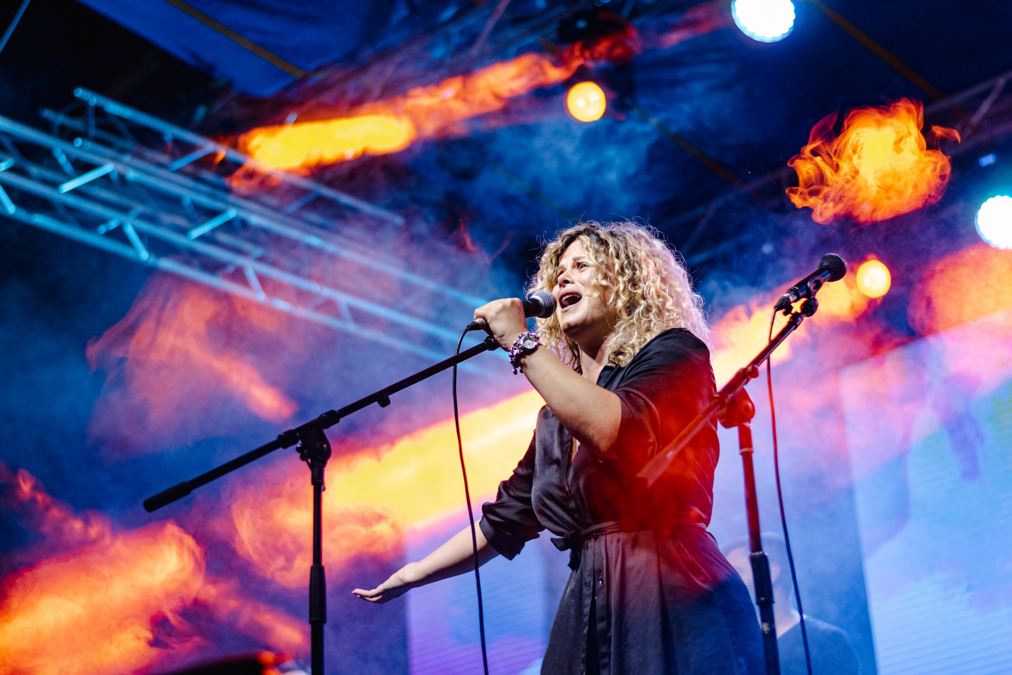 Dani Dimitrovska singing surrounded by flames