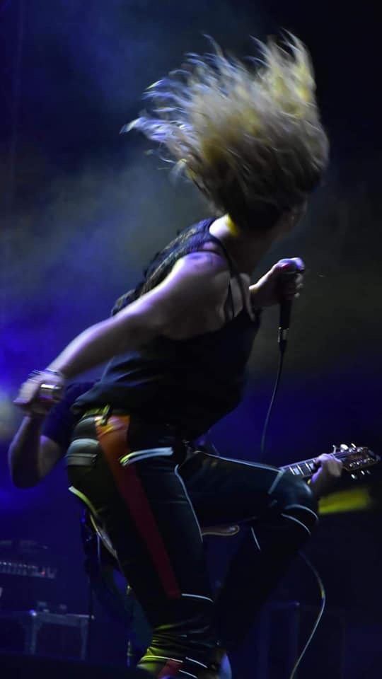 Dani Dimitrovska headbanging on stage